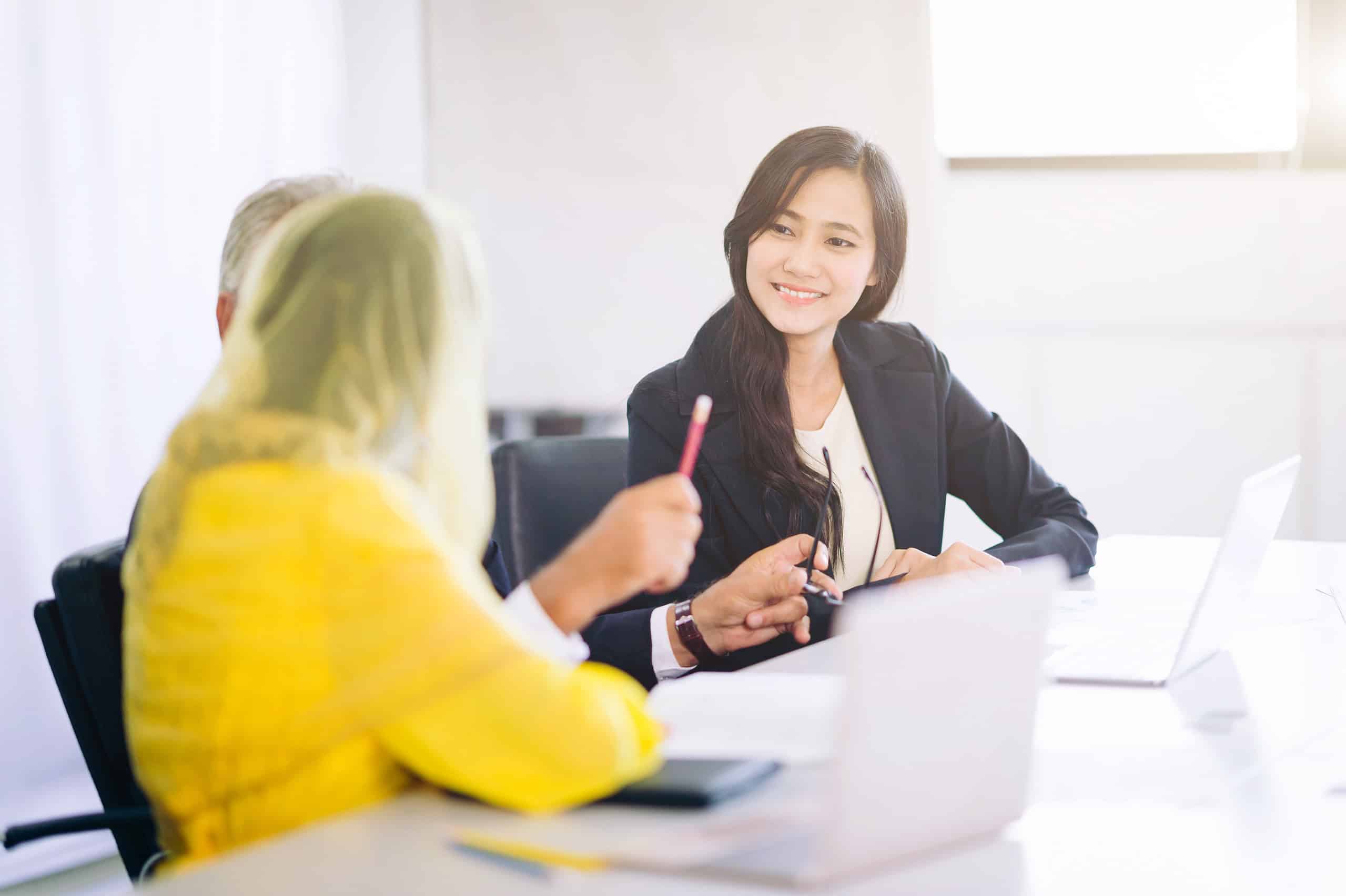 arab woman business partners brainstoming and discussing documents and planning business strategy in office room