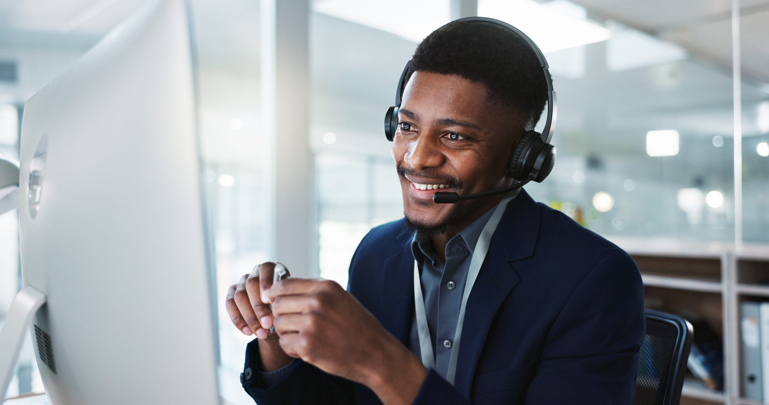 computer, call center and happy black man talking, crm and technical support at help desk. communication, customer service and sales agent consulting, telemarketing advisory and speaking to contact