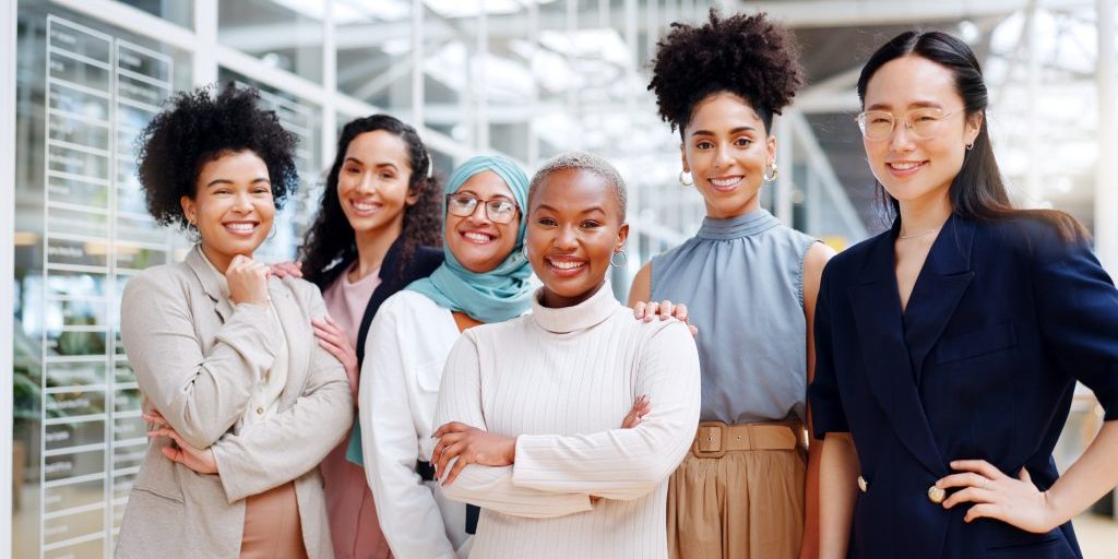 corporate women, empowerment and portrait of team with smile at hr department at creative marketing startup. teamwork, diversity and confident group of happy women and ideas in human resources office